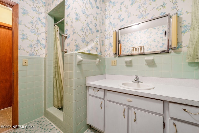 bathroom with vanity, tile walls, tile patterned flooring, and a shower with curtain