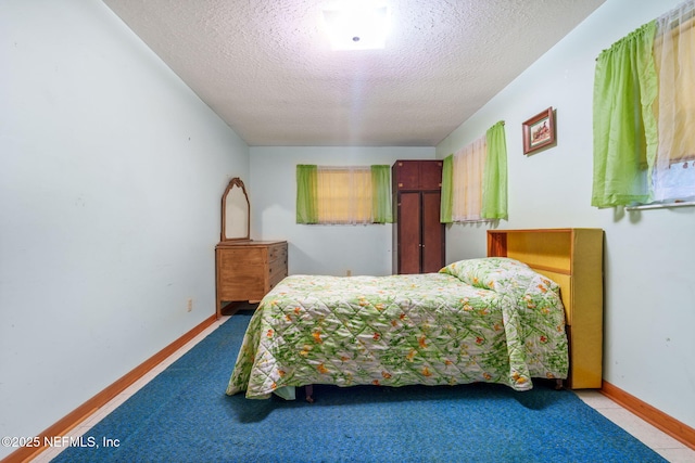 bedroom featuring a textured ceiling