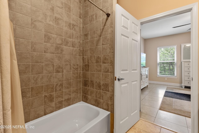 bathroom featuring tile patterned flooring and shower / bath combo with shower curtain