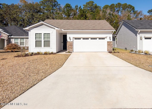 ranch-style house featuring a garage and a front yard