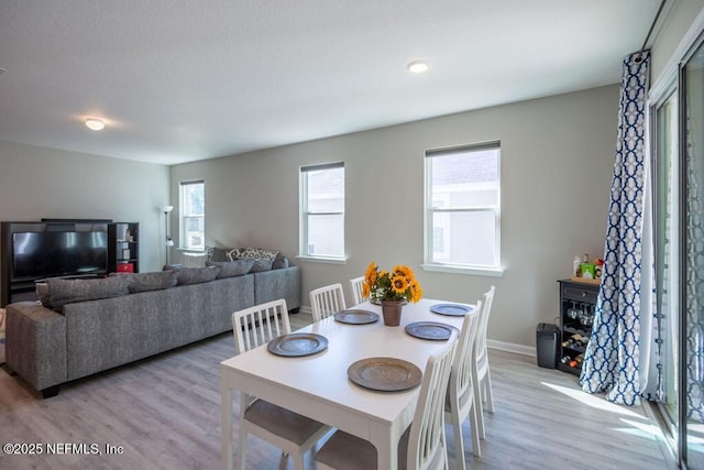 dining space featuring light hardwood / wood-style floors