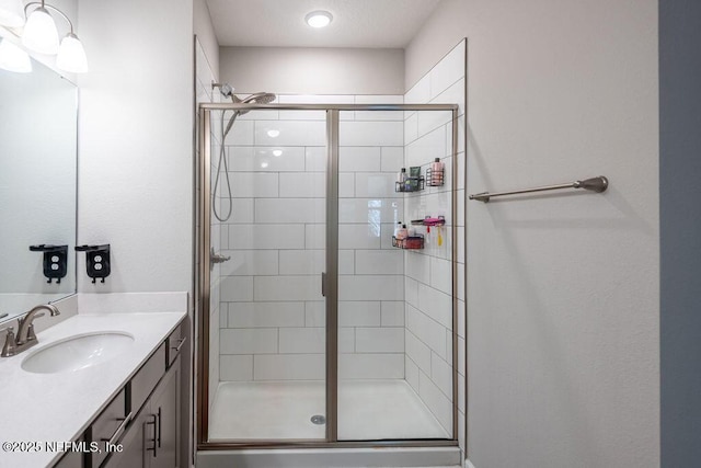 bathroom featuring vanity and walk in shower