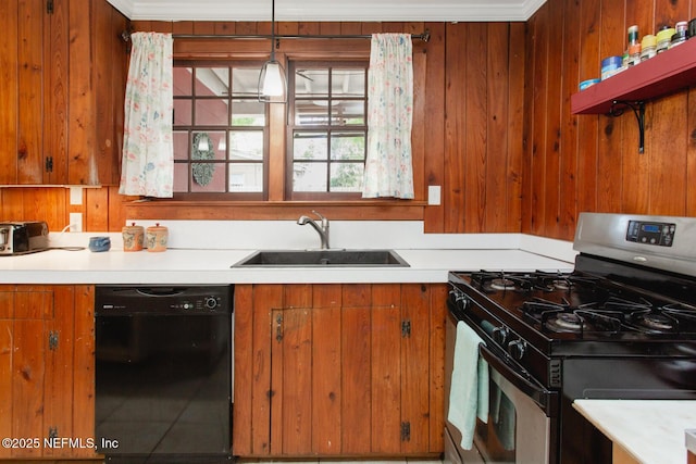 kitchen with pendant lighting, dishwasher, stainless steel gas stove, sink, and crown molding