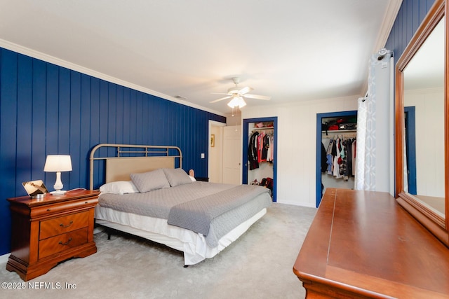 bedroom featuring ceiling fan, carpet floors, and ornamental molding