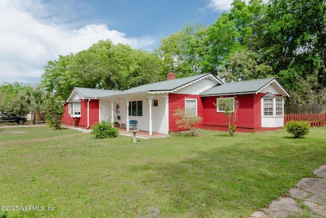 exterior space featuring a lawn and a porch