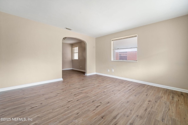 unfurnished room with light hardwood / wood-style flooring