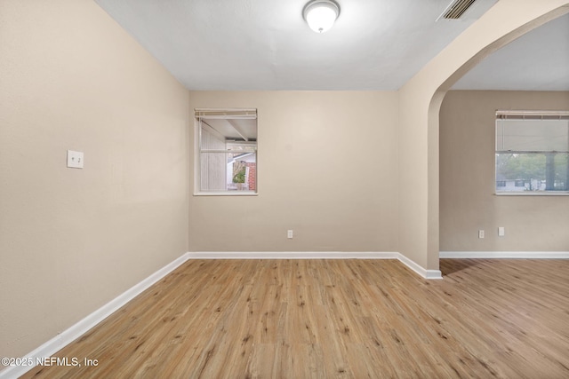 spare room with light wood-type flooring