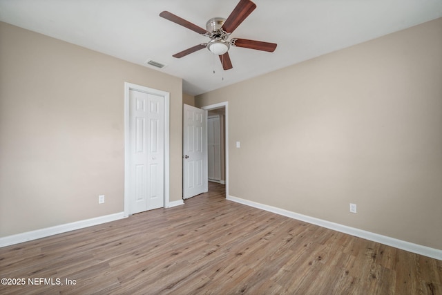 unfurnished bedroom featuring ceiling fan and light hardwood / wood-style flooring