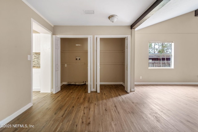 unfurnished bedroom featuring hardwood / wood-style floors