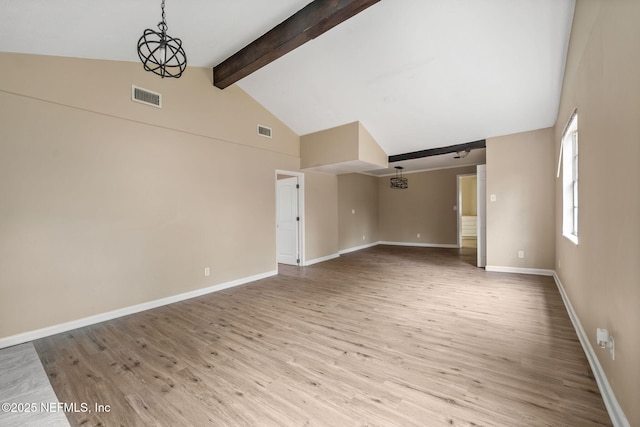 unfurnished living room with beamed ceiling, high vaulted ceiling, an inviting chandelier, and light hardwood / wood-style floors