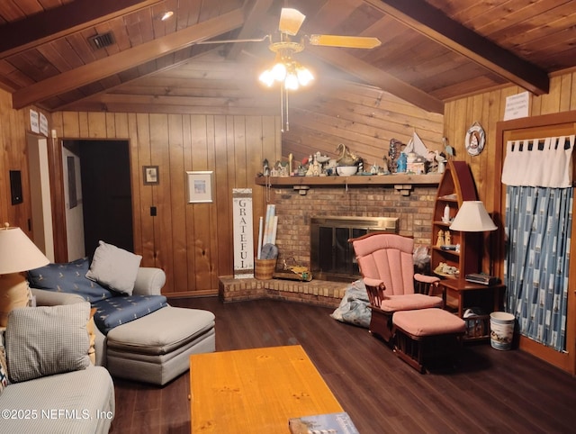 living room featuring lofted ceiling with beams, a brick fireplace, wooden ceiling, and wood walls