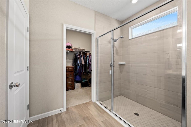 bathroom featuring an enclosed shower