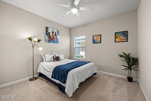 bedroom featuring ceiling fan and light colored carpet