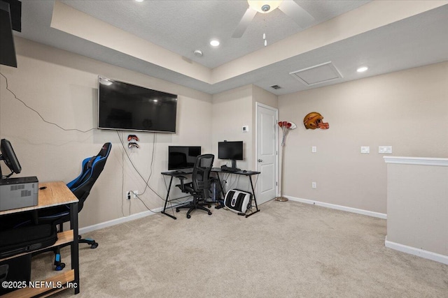 office with light carpet and a raised ceiling