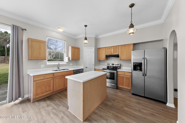 kitchen featuring a center island, sink, hanging light fixtures, and appliances with stainless steel finishes