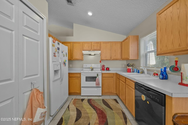 kitchen with vaulted ceiling, light tile patterned floors, light brown cabinets, and white appliances