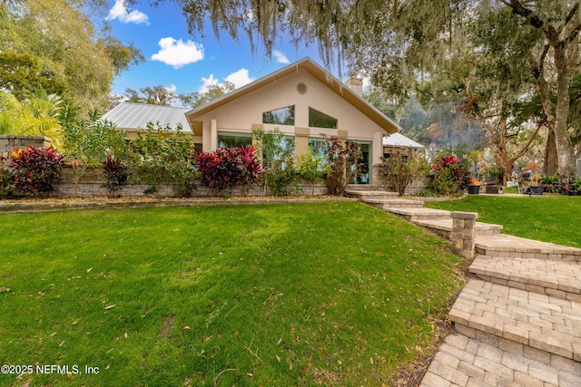 view of front of home with a front lawn