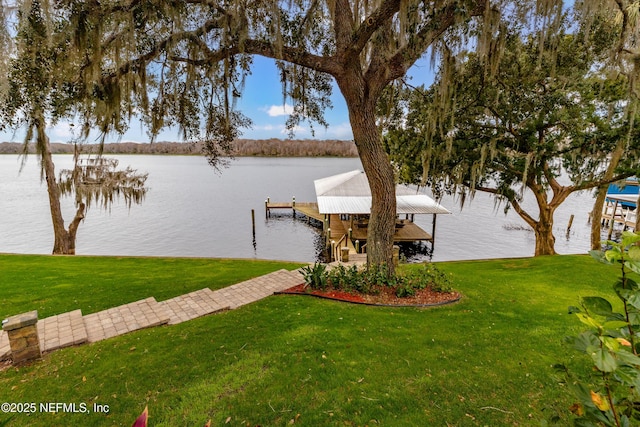 view of dock featuring a water view and a lawn