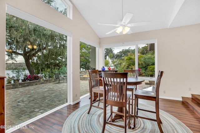 sunroom / solarium with ceiling fan, lofted ceiling, and a water view