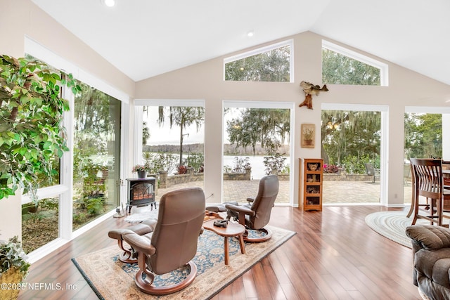 sunroom / solarium featuring a wood stove