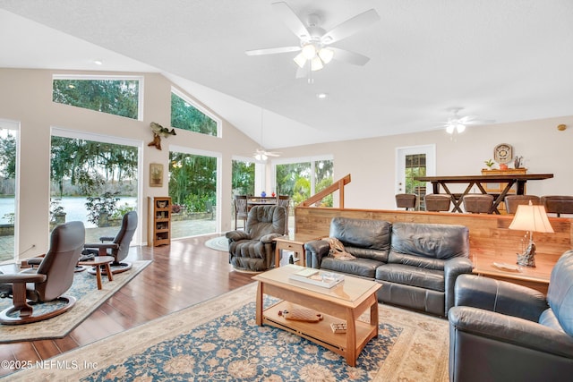 living room with lofted ceiling and light hardwood / wood-style flooring