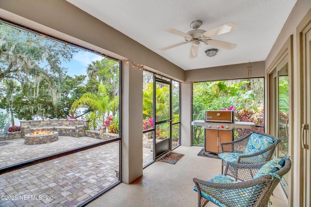 sunroom / solarium with ceiling fan