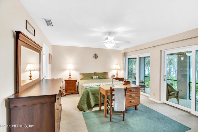 carpeted bedroom featuring ceiling fan and access to exterior