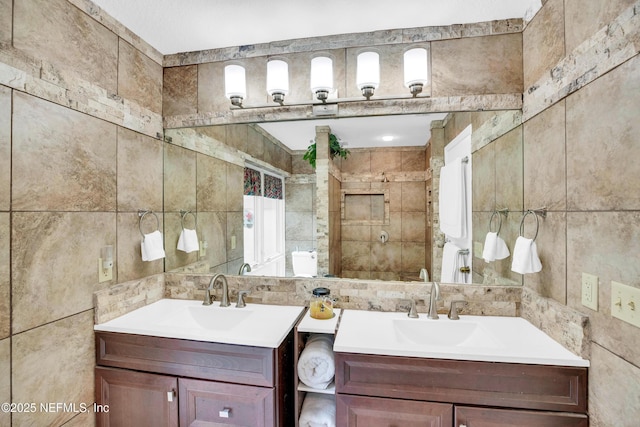 bathroom featuring tile walls, a shower with curtain, and vanity