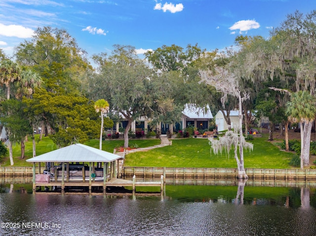 view of dock featuring a water view and a lawn