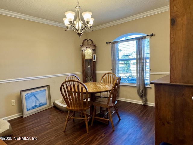 dining area with ornamental molding, dark hardwood / wood-style floors, a chandelier, and a textured ceiling