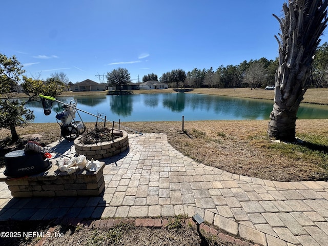 property view of water featuring a fire pit