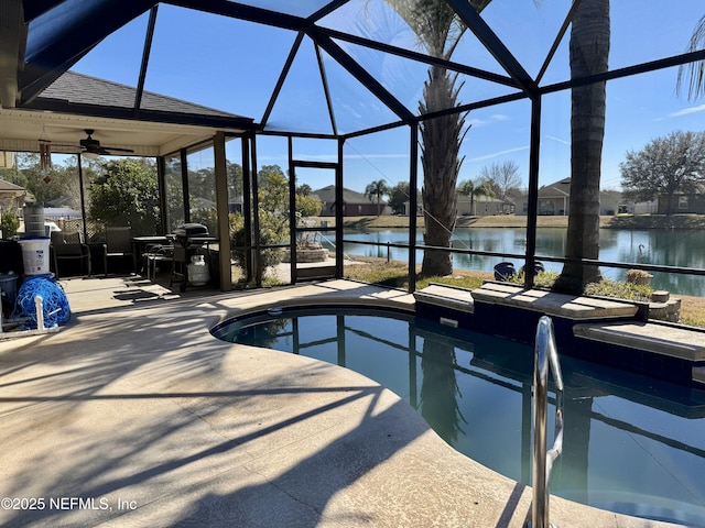 view of pool featuring a water view, a lanai, ceiling fan, and a patio area