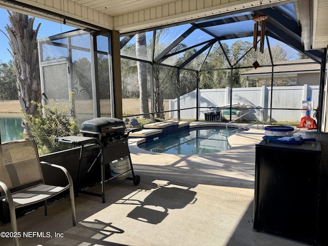 view of pool featuring area for grilling, a lanai, a patio, and a water view