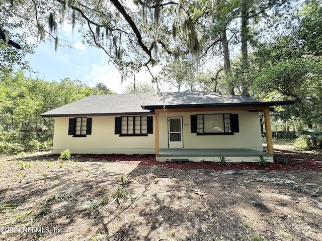 ranch-style house featuring a porch