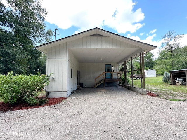 view of vehicle parking featuring a carport