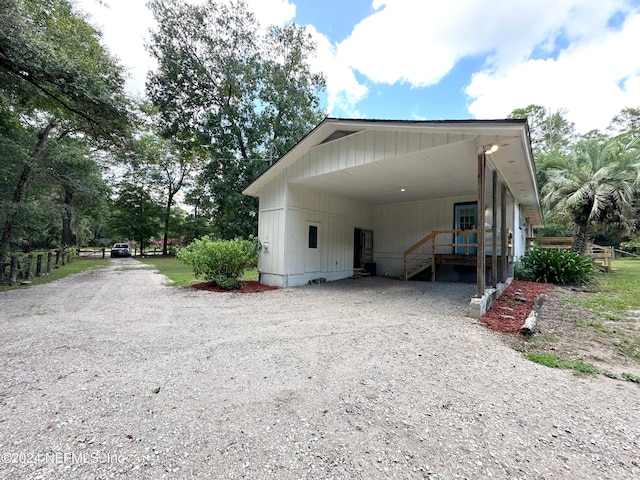 view of property exterior with a carport