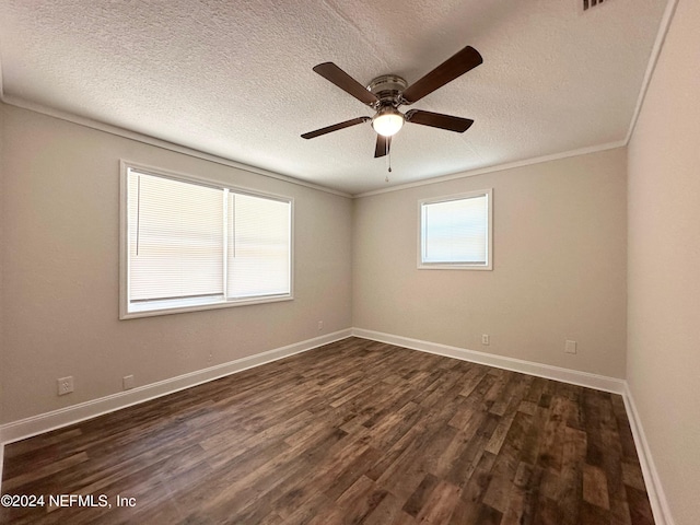 spare room with ceiling fan, dark hardwood / wood-style flooring, ornamental molding, and a textured ceiling