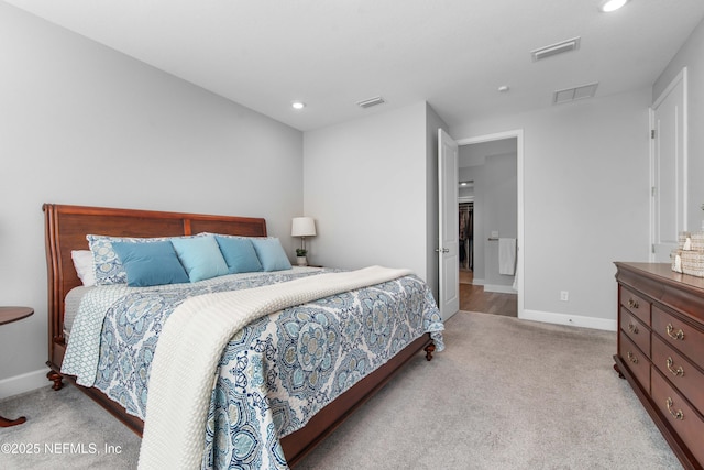 bedroom with light colored carpet