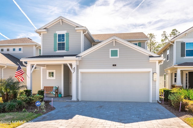 view of front of home featuring a garage and a porch