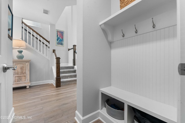 mudroom with light hardwood / wood-style flooring