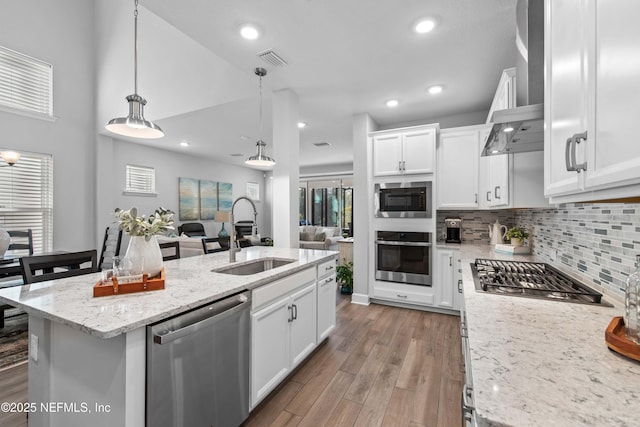 kitchen featuring sink, stainless steel appliances, and white cabinets