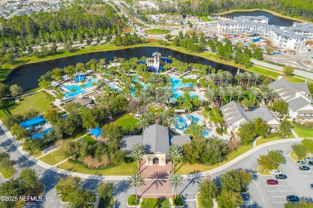 birds eye view of property with a water view