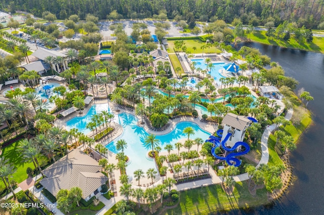 birds eye view of property with a water view