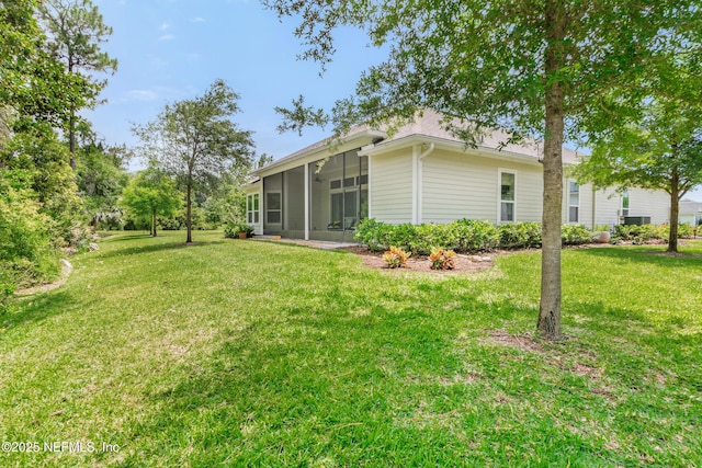 view of yard with a sunroom