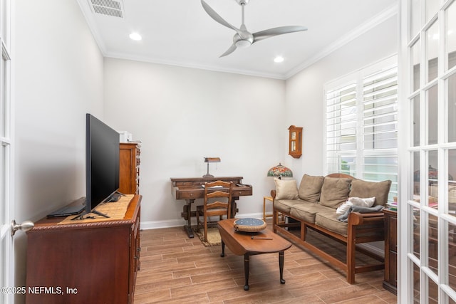 living room with wood finish floors, visible vents, and crown molding