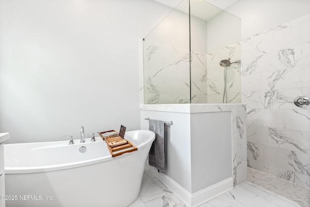 bathroom with a soaking tub, marble finish floor, and a marble finish shower