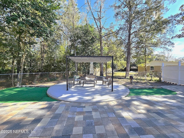 view of property's community featuring a pergola and a patio