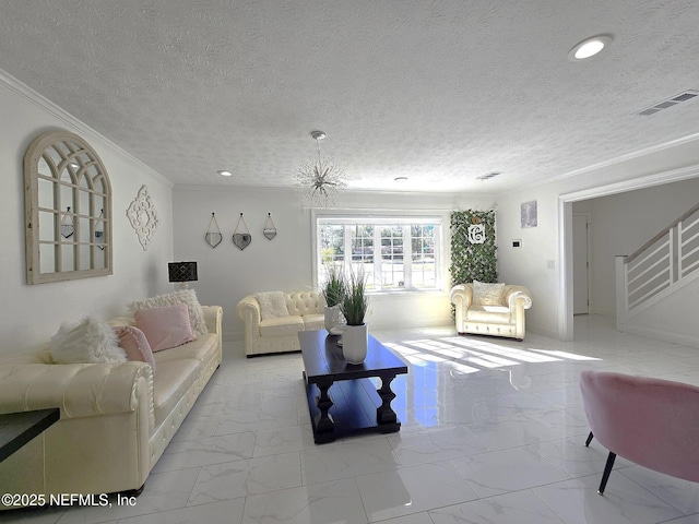 living room featuring ornamental molding and a textured ceiling