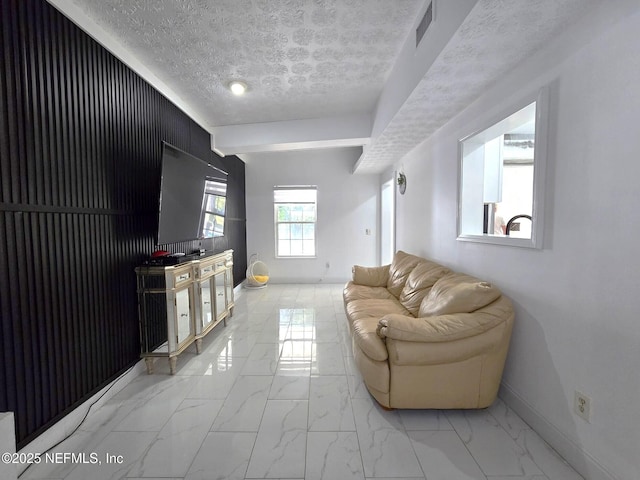 living room with a textured ceiling