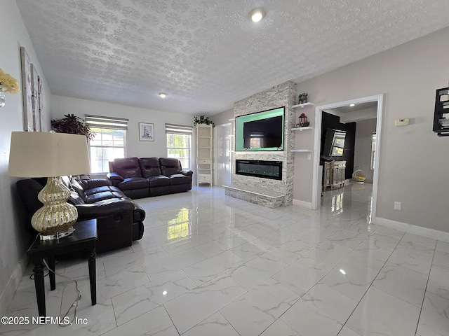 living room with a fireplace and a textured ceiling